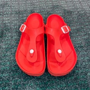 Bright orange Birkenstock sandals